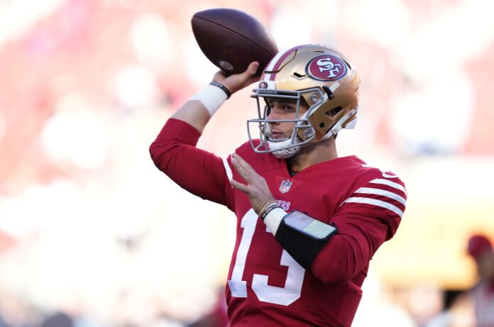 Brock Purdy (13) warms up before a NFC Divisional Round game against the Dallas Cowboys at Levi's Stadium.