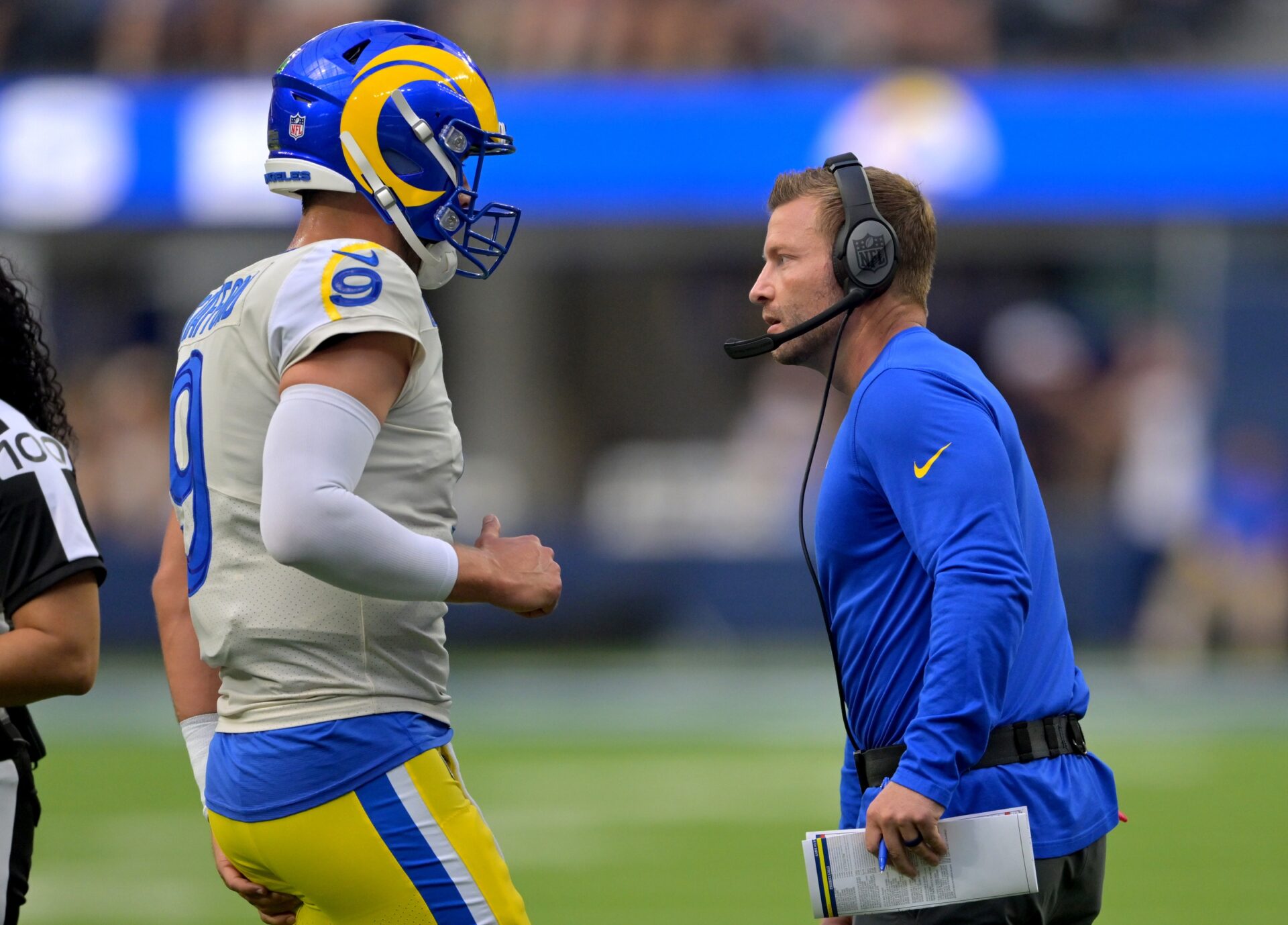 Matthew Stafford talks with head coach Sean McVay on the sidelines.