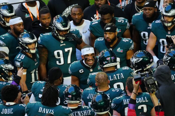 Philadelphia Eagles QB Jalen Hurts pumps up the team before the start of the Super Bowl.