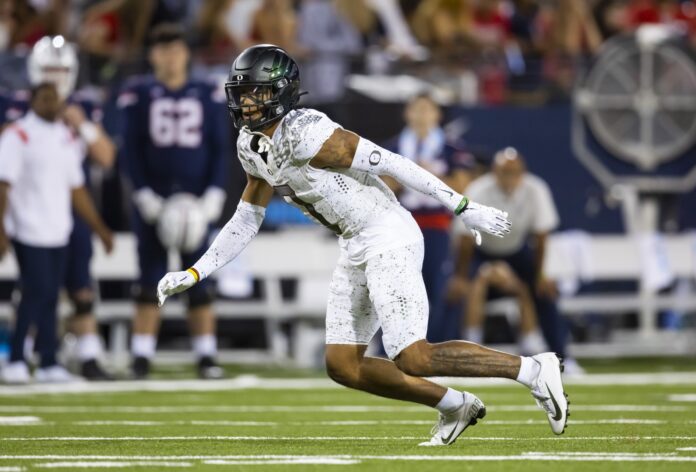 Oregon CB Christian Gonzalez (0) reacts during a play against Arizona.