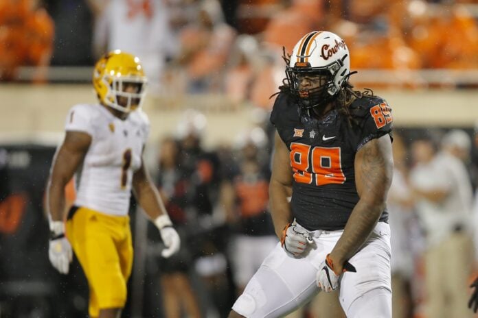 Oklahoma State DE Tyler Lacy (89) celebrates after making a play against Arizona State.