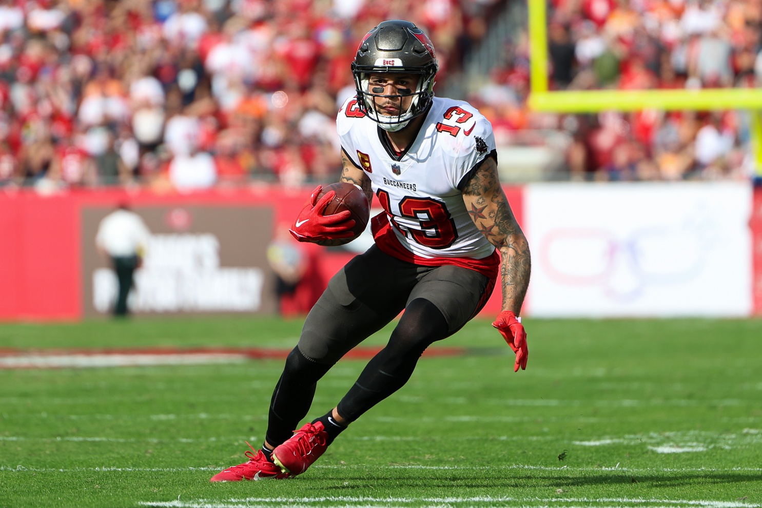 Mike Evans (13) runs with the ball against the Carolina Panthers in the second quarter at Raymond James Stadium.