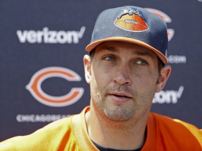 Jay Cutler (6) answers questions from media after the first day of the minicamp at Halas Hall.