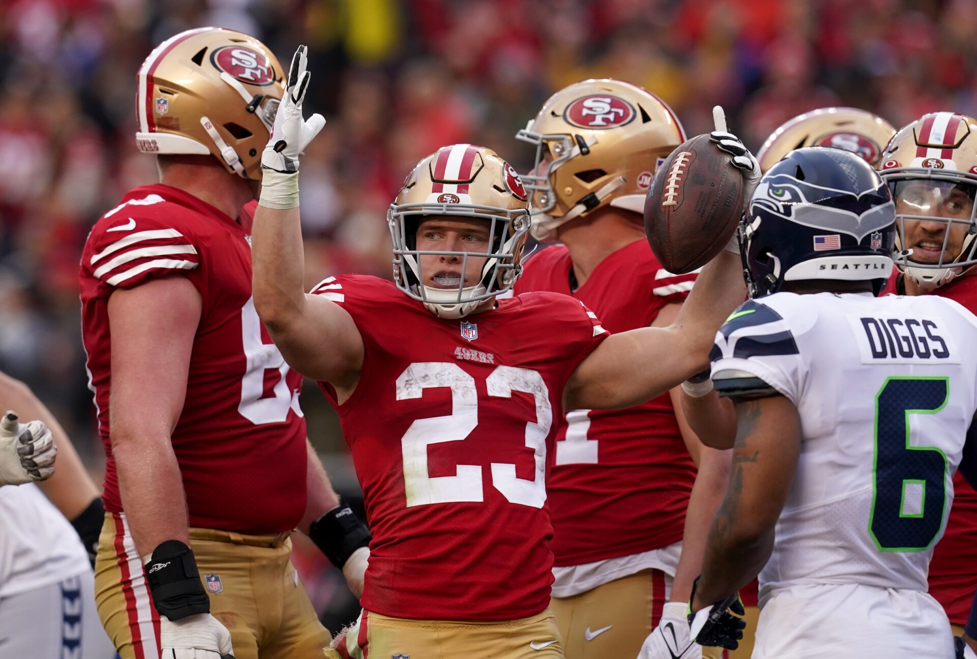 Christian McCaffrey (23) looks for a touchdown signal in the third quarter of a Wild Card game against the Seattle Seahawks.