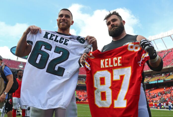 Travis Kelce (87) swaps jerseys with Philadelphia Eagles center Jason Kelce (62) after the game at Arrowhead Stadium.