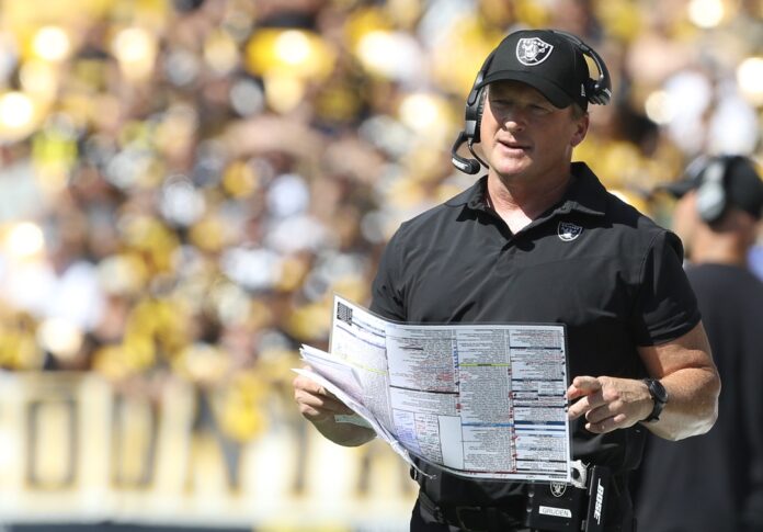 Jon Gruden looks on from the sidelines against the Pittsburgh Steelers.