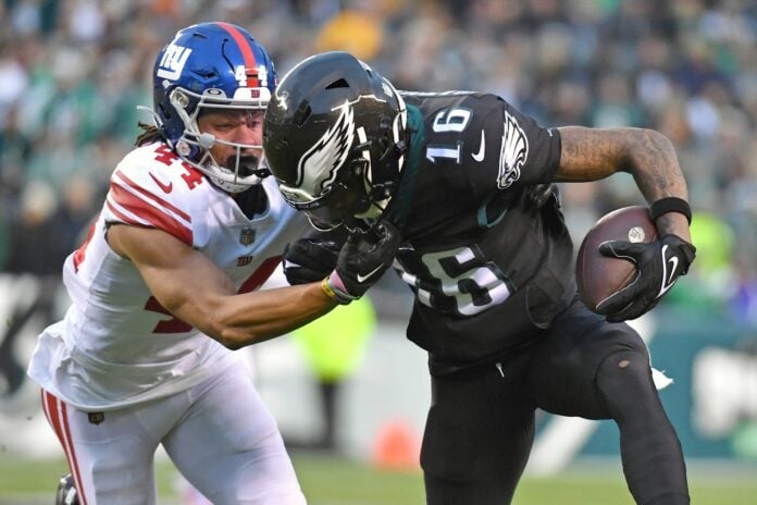 Philadelphia Eagles WR Quez Watkins (16) tries to shake off a tackle against the New York Giants.