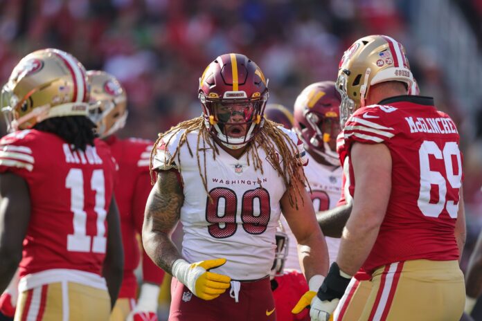Washington Commanders DE Chase Young (99) reacts after a play against the San Francisco 49ers.
