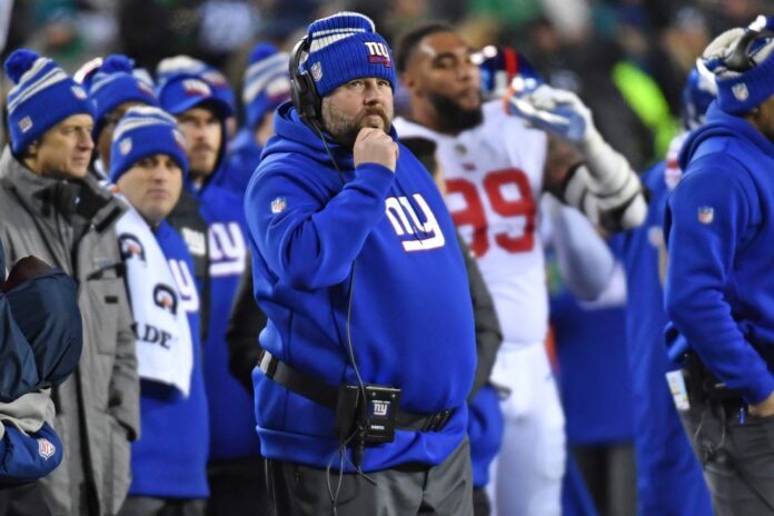 New York Giants head coach Brian Daboll calling plays on the sidelines.
