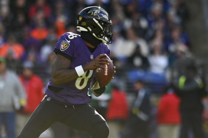 Baltimore Ravens QB Lamar Jackson (8) drops back to pass against the Denver Broncos.