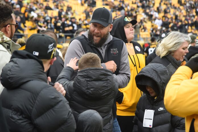 Former Pittsburgh Steelers QB Ben Roethlisberger jokes around on the sidelines before a game.