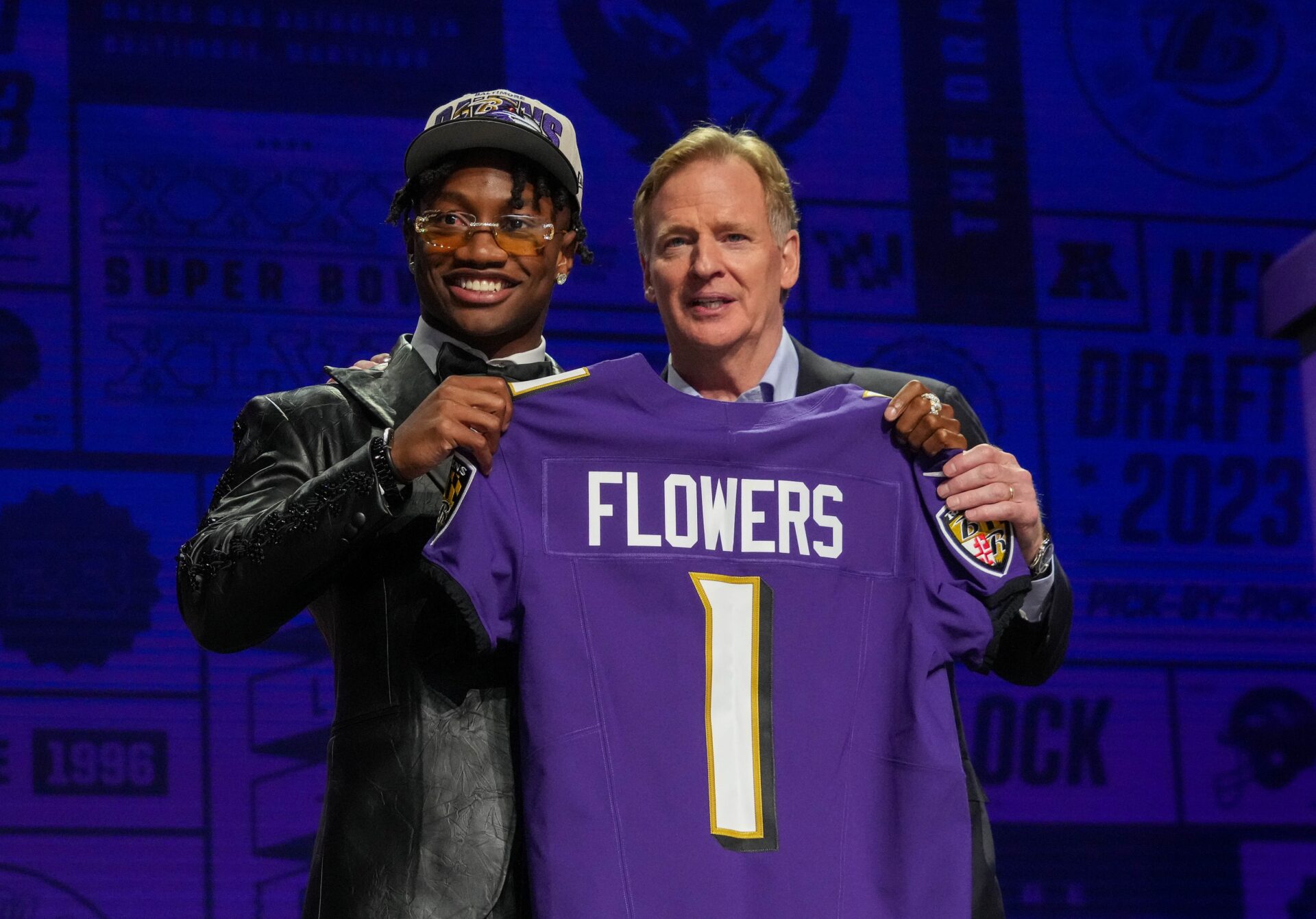 WR Zay Flowers and NFL Commissioner Roger Goodell pose for pictures after the Baltimore Ravens selected Flowers in the first round of the 2023 NFL Draft.