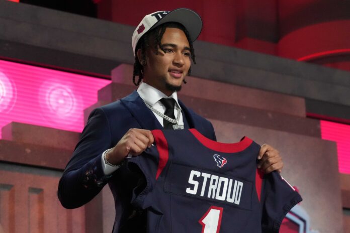 Quarterback C.J. Stroud poses for pictures with his jersey after being selected No. 2 overall by the Houston Texans.