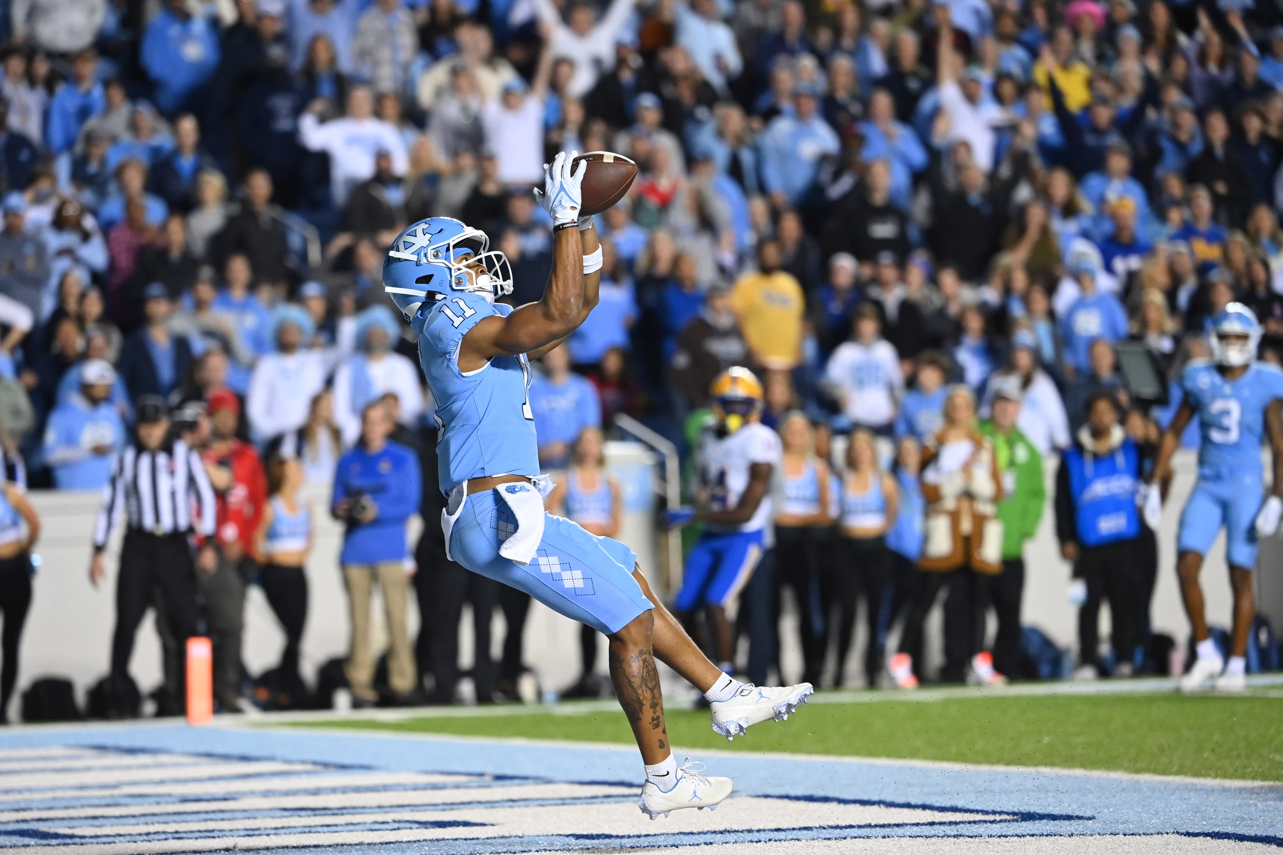 North Carolina Tar Heels wide receiver Josh Downs (11) catches a touchdown pass in the fourth quarter at Kenan Memorial Stadium.