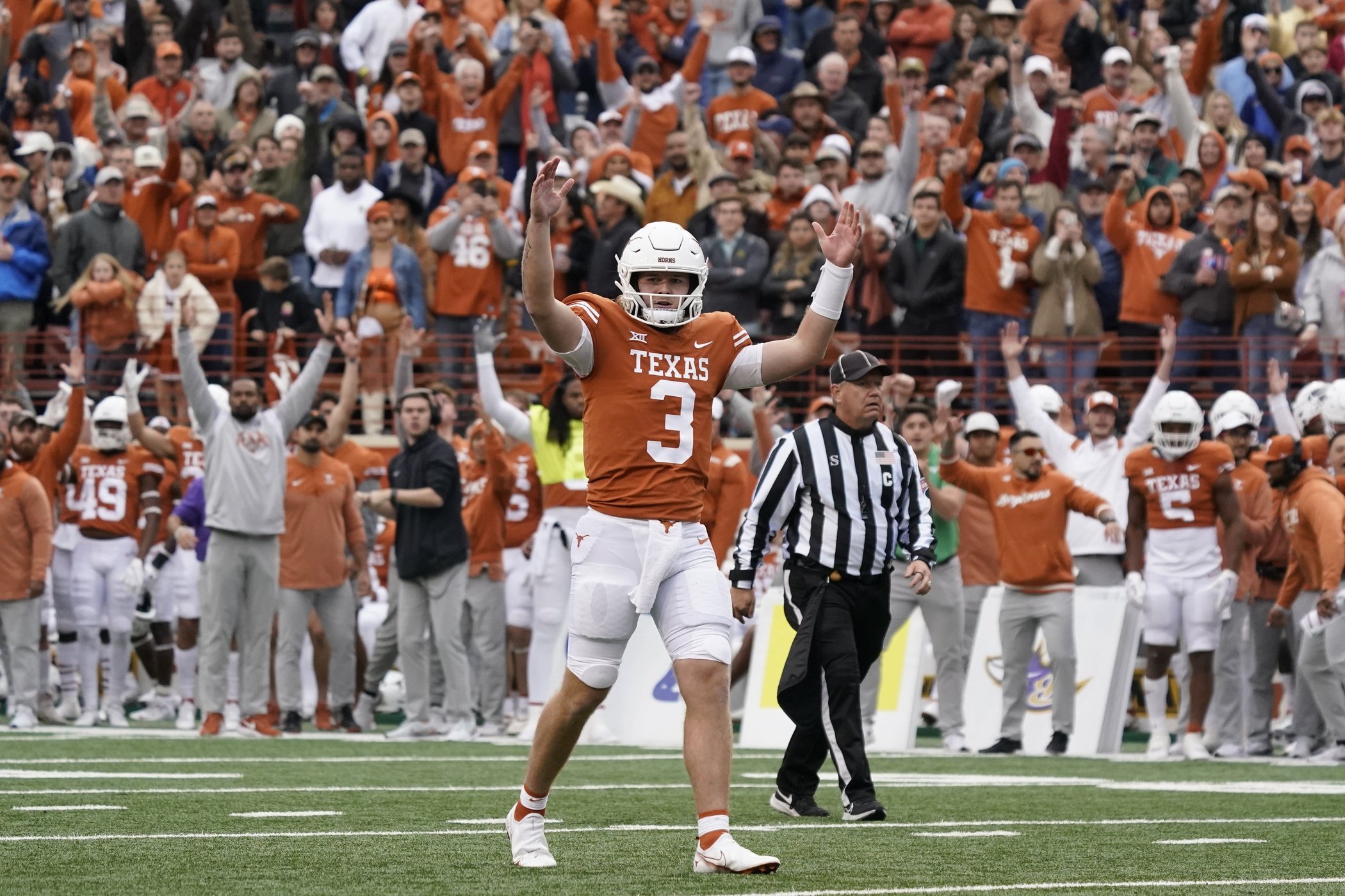 Texas Longhorns quarterback Quinn Ewers (3) signals a touchdown during the second half against the Baylor Bears at Darrell K Royal-Texas Memorial Stadium.