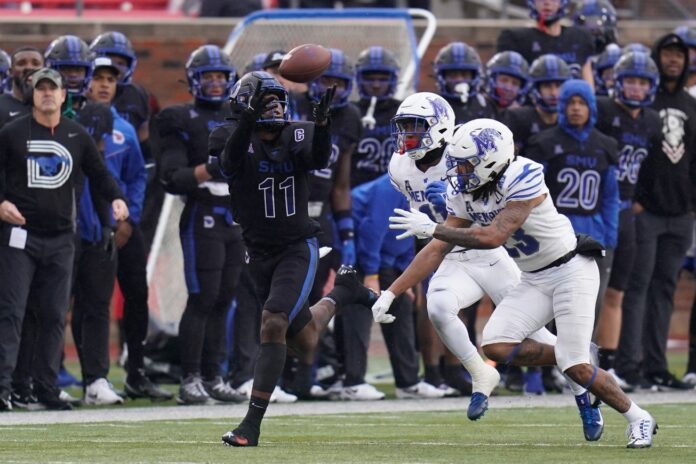 Rashee Rice (11) makes a catch in front of Memphis Tigers defensive back Ladarian Paulk (23)during the first half at Gerald J. Ford Stadium.