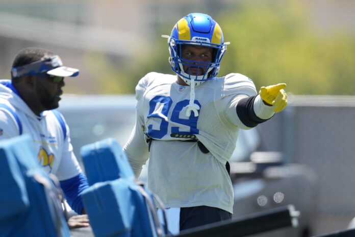 Los Angeles Rams defensive end Aaron Donald (99) gestures during training camp at Cal Lutheran University.