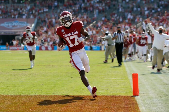 OU's Marvin Mims (17) scores a touchdown during last season's win against Texas in Dallas.
