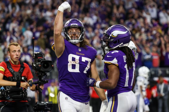 T.J. Hockenson (87) celebrates his two-point conversion during the fourth quarter against the Indianapolis Colts at U.S. Bank Stadium.
