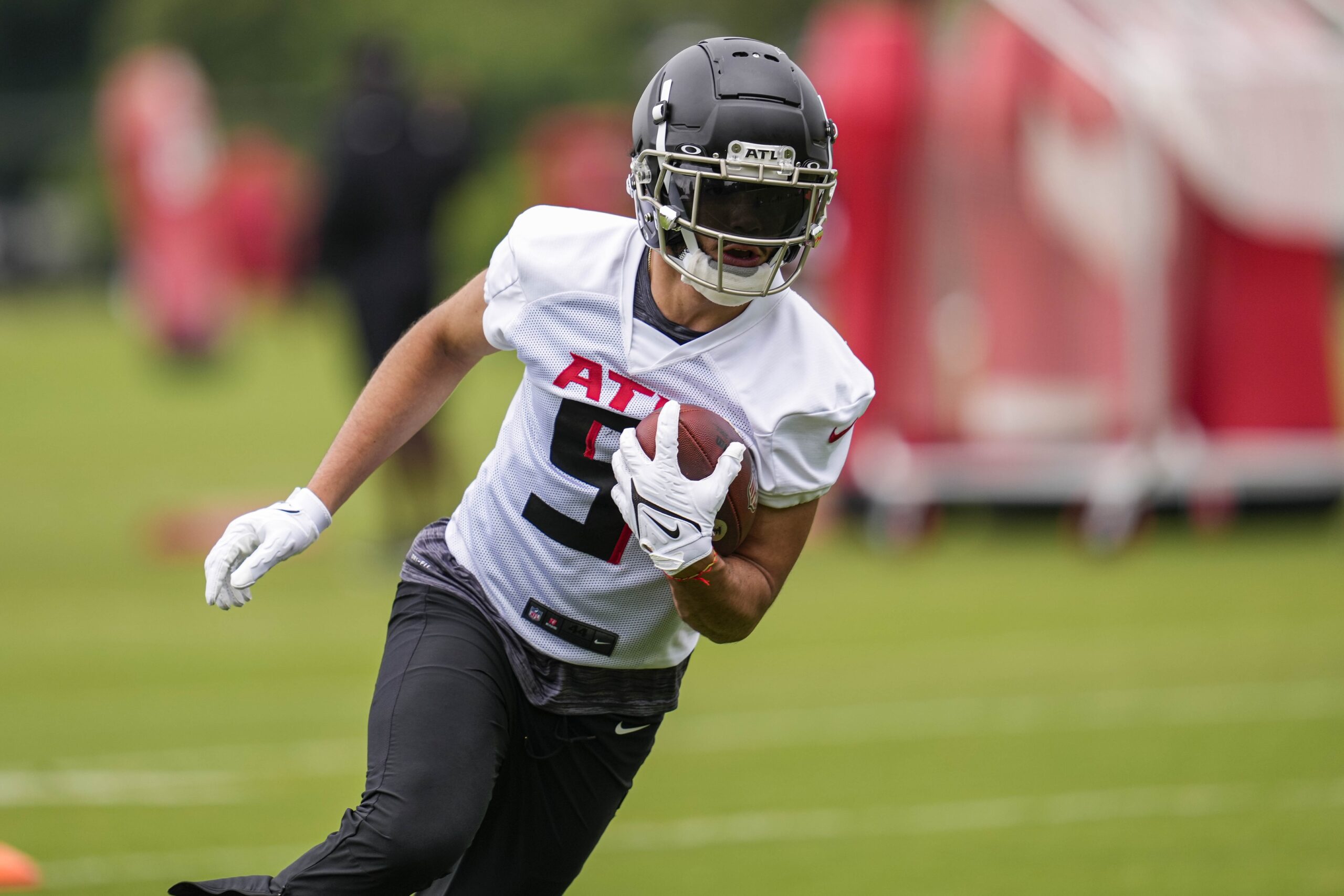 Atlanta Falcons wide receiver Drake London (5) walks off the field after an  NFL football game