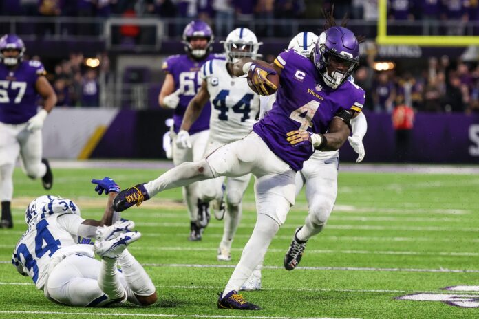 Minnesota Vikings RB Dalvin Cook (4) breaks a tackle against the Indianapolis Colts.
