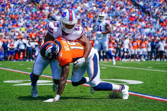 Buffalo Bills LB Tyrel Dodson (53) tackles Denver Broncos WR Seth Williams (19).