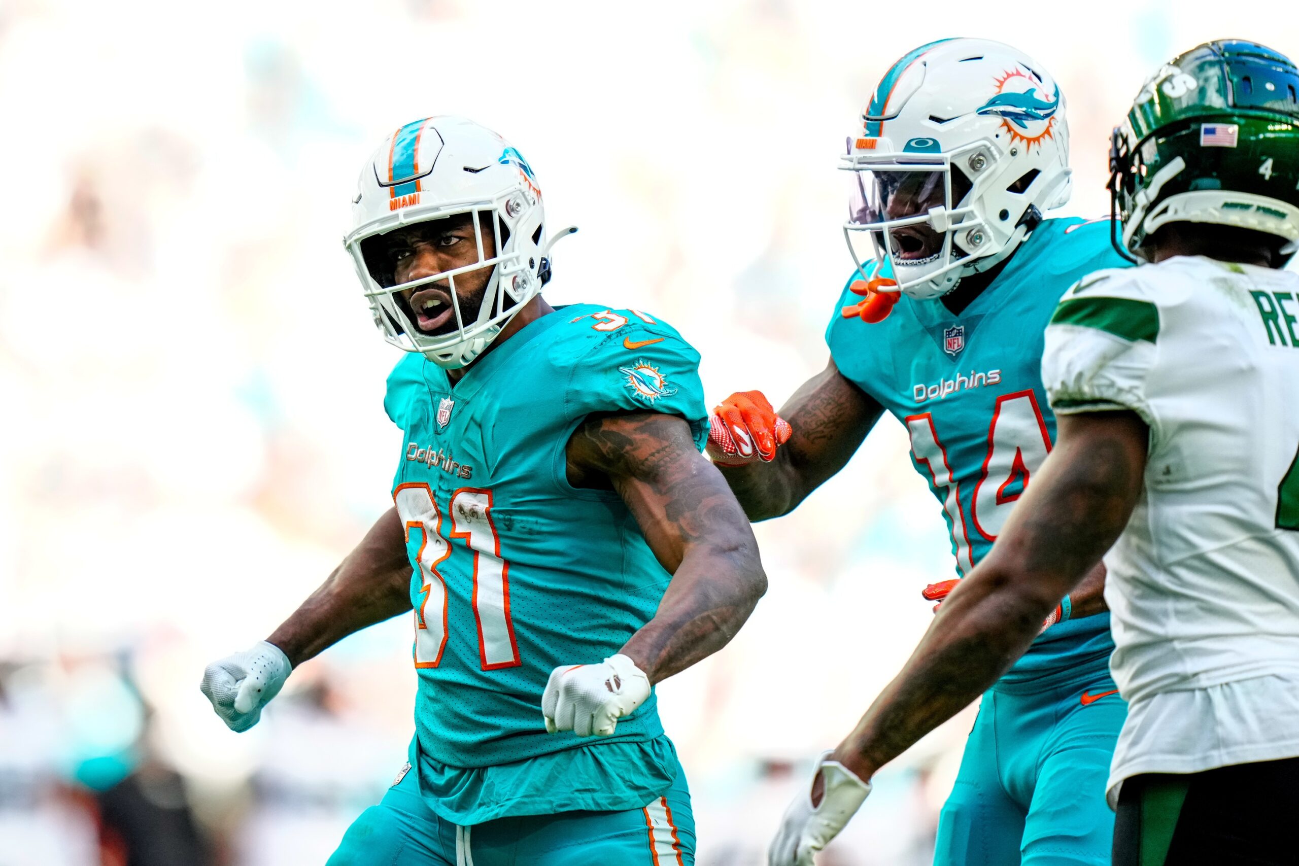 Raheem Mostert (31) celebrates gaining yardage against the New York Jets during the second half at Hard Rock Stadium.