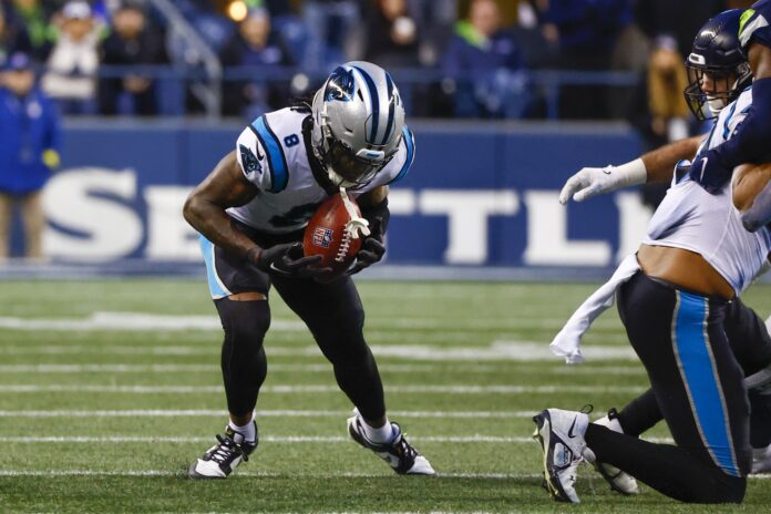 Carolina Panthers CB Jaycee Horn (8) recovers an onside kick against the Seattle Seahawks.