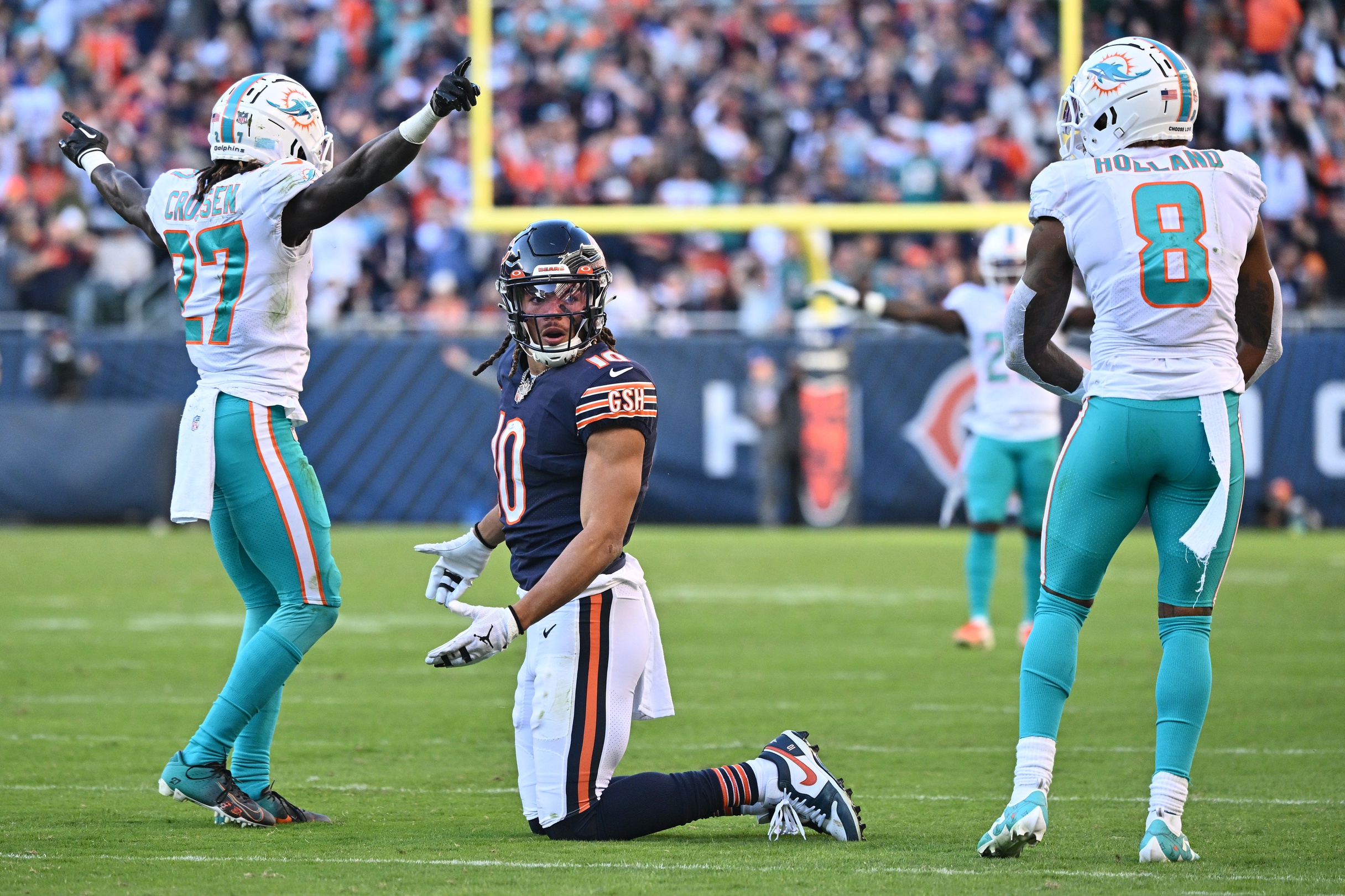 Chase Claypool (10) looks for a call from the referee after Miami Dolphins defensive back Keion Crossen (27) and safety Jevon Holland (8) break up a pass in the fourth quarter at Soldier Field.