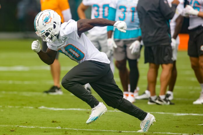 Miami Dolphins wide receiver Tyreek Hill (10) runs on the field during mandatory minicamp.