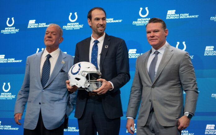Shane Steichen, center, poses for photos with Colts Owner and CEO Jim Irsay, left, and General Manager Chris Ballard after a press conference.