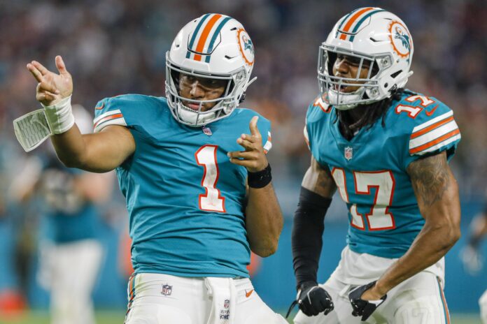 Miami Dolphins QB Tua Tagovailoa (1) and WR Jaylen Waddle (17) celebrate a first down.