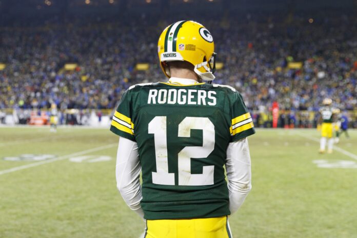 Quarterback Aaron Rodgers (12) looks on during the game from the Green Bay Packers sideline.