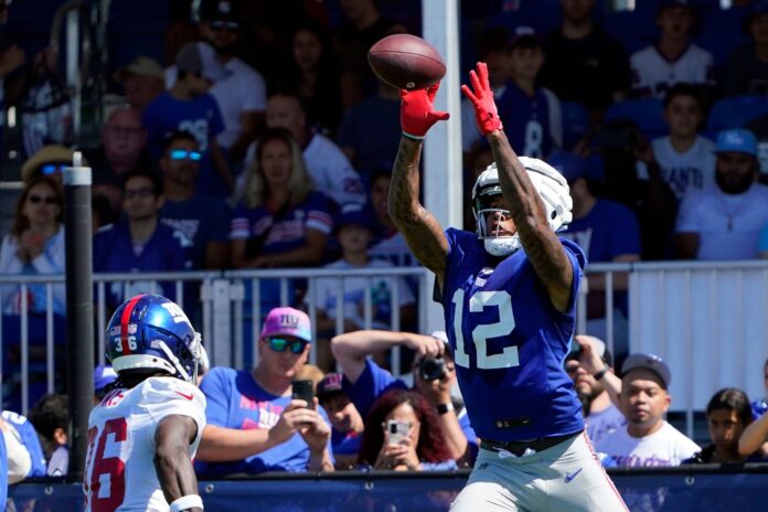 New York Giants TE Darren Waller (12) catches a pass during training camp.