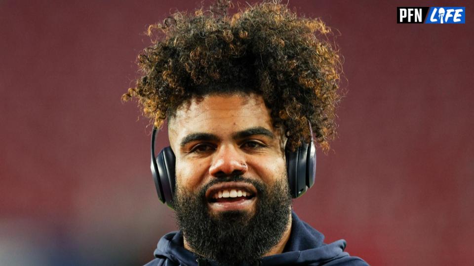 In this Aug. 9, 2018, file photo, Dallas Cowboys running back Ezekiel  Elliott (21) smiles as he runs off the field after the first half of an NFL  preseason football game against