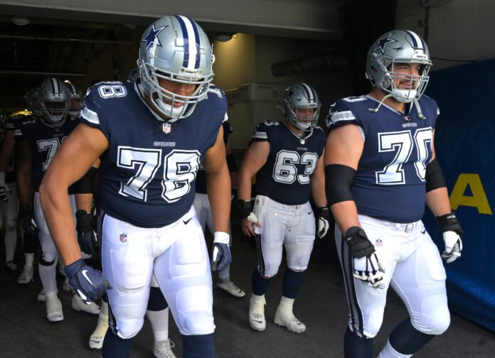 Terence Steele (78) and guard Zack Martin (70) enter the field for the game against the Los Angeles Rams at SoFi Stadium.