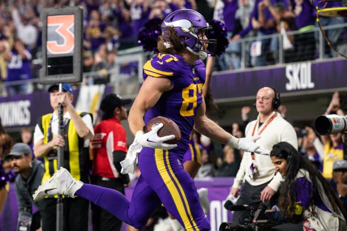 Minnesota Vikings tight end T.J. Hockenson (87) on the field with teammates  during the first half of an NFL football game against the New England  Patriots, Thursday, Nov. 24, 2022 in Minneapolis. (