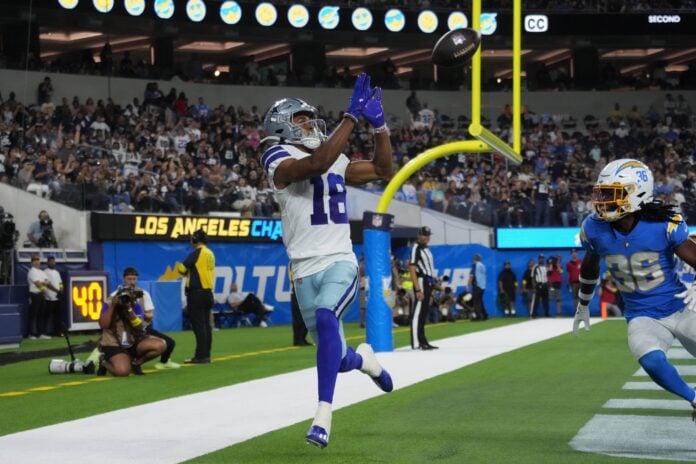 Dallas Cowboys WR Jalen Tolbert (18) catches a touchdown against the Los Angeles Chargers.