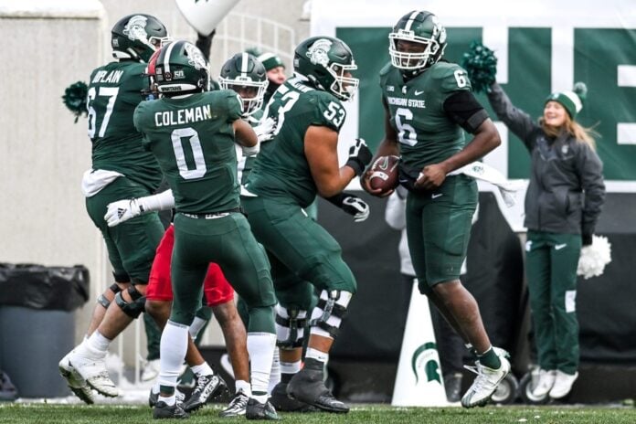 Michigan State Spartans TE Maliq Carr (6) celebrates with teammates after scoring a touchdown.