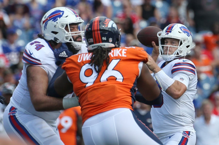 Denver Broncos defensive back Mike Ford (12) reacts against the