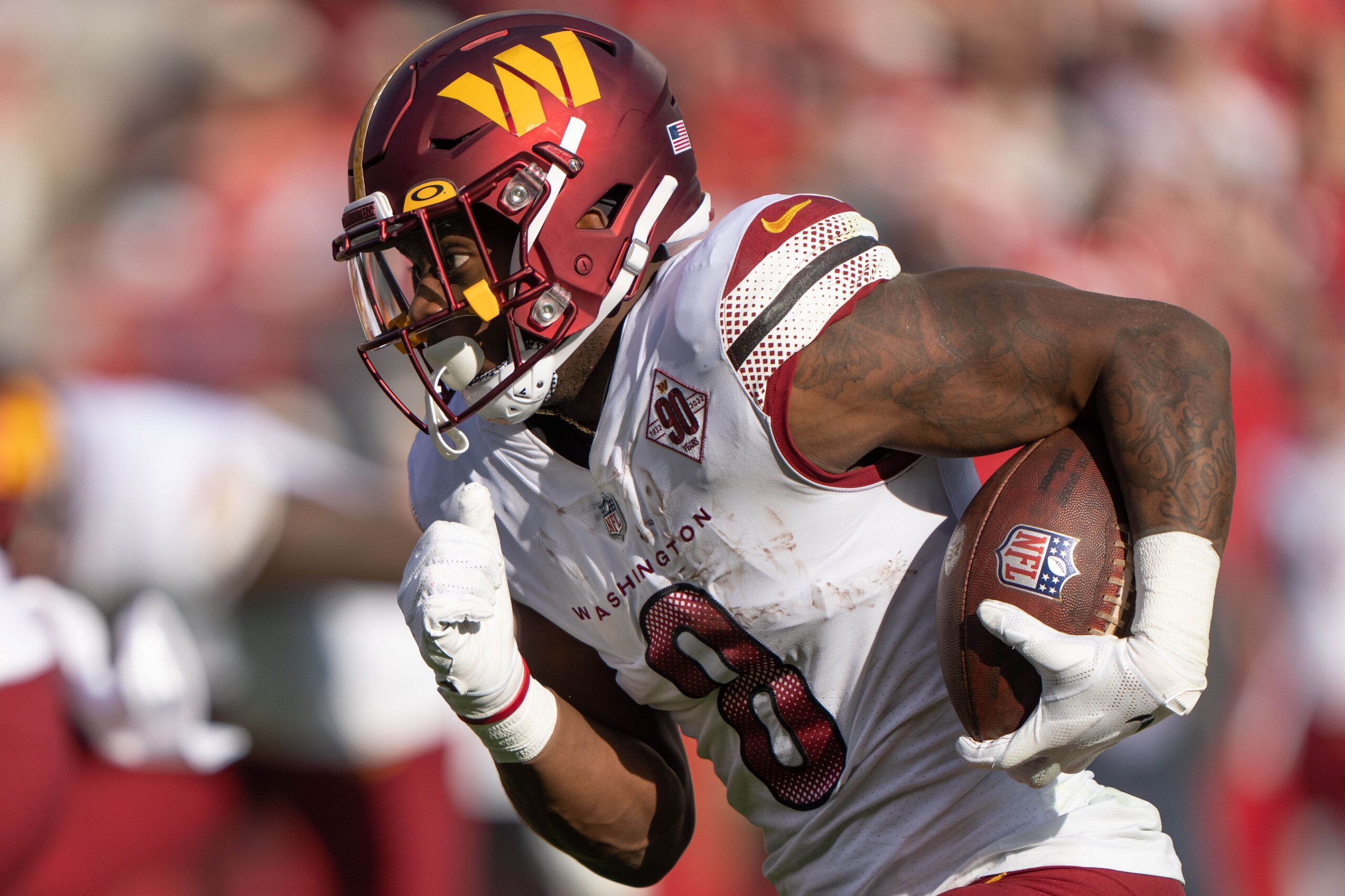 Washington Commanders running back Brian Robinson (8) is tackled