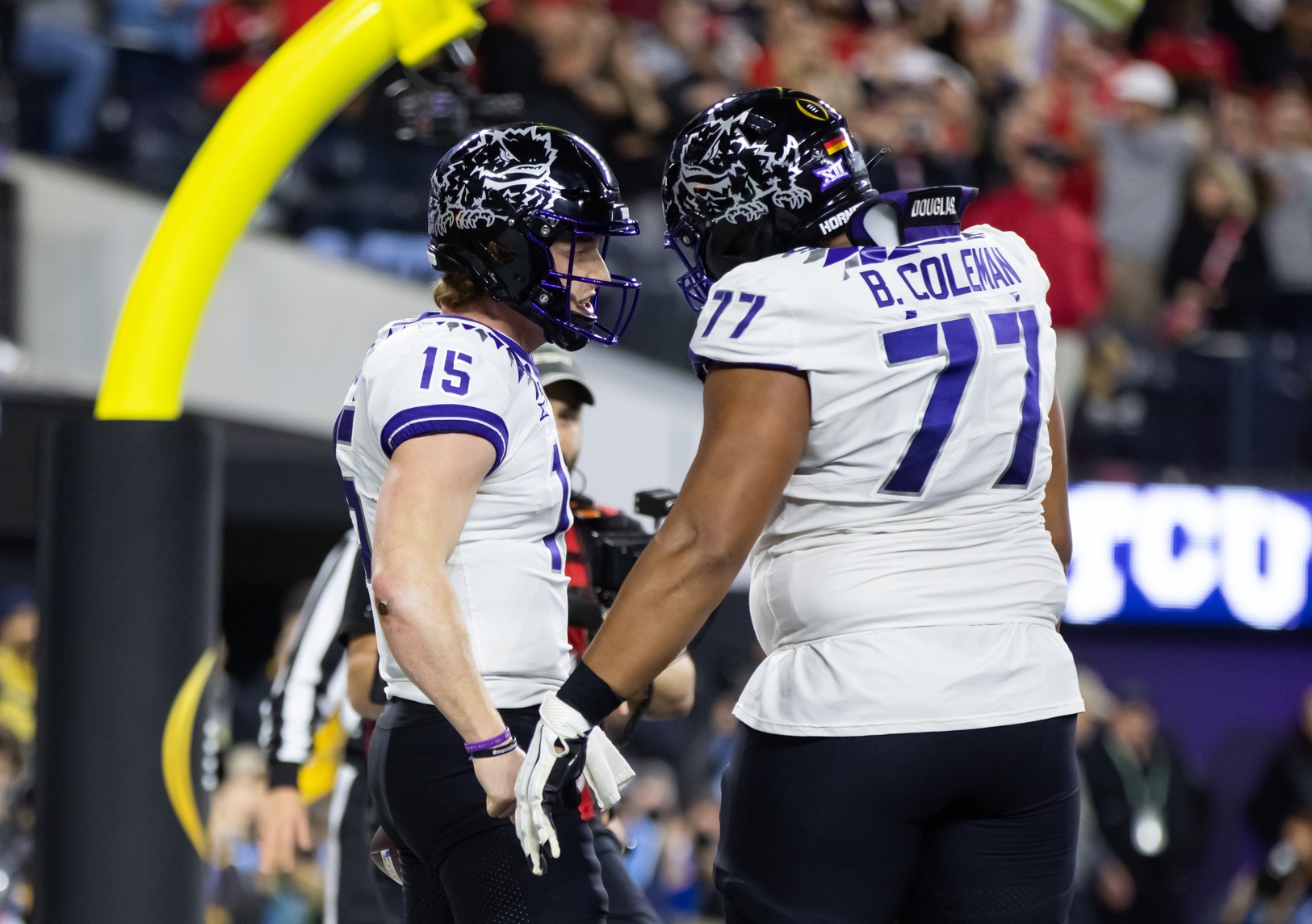 Max Duggan (15) celebrates a touchdown with offensive tackle Brandon Coleman (77) against the Georgia Bulldogs during the CFP national championship game at SoFi Stadium.