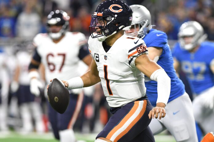 Chicago Bears QB Justin Fields (1) scrambles out of the pocket against the Detroit Lions.