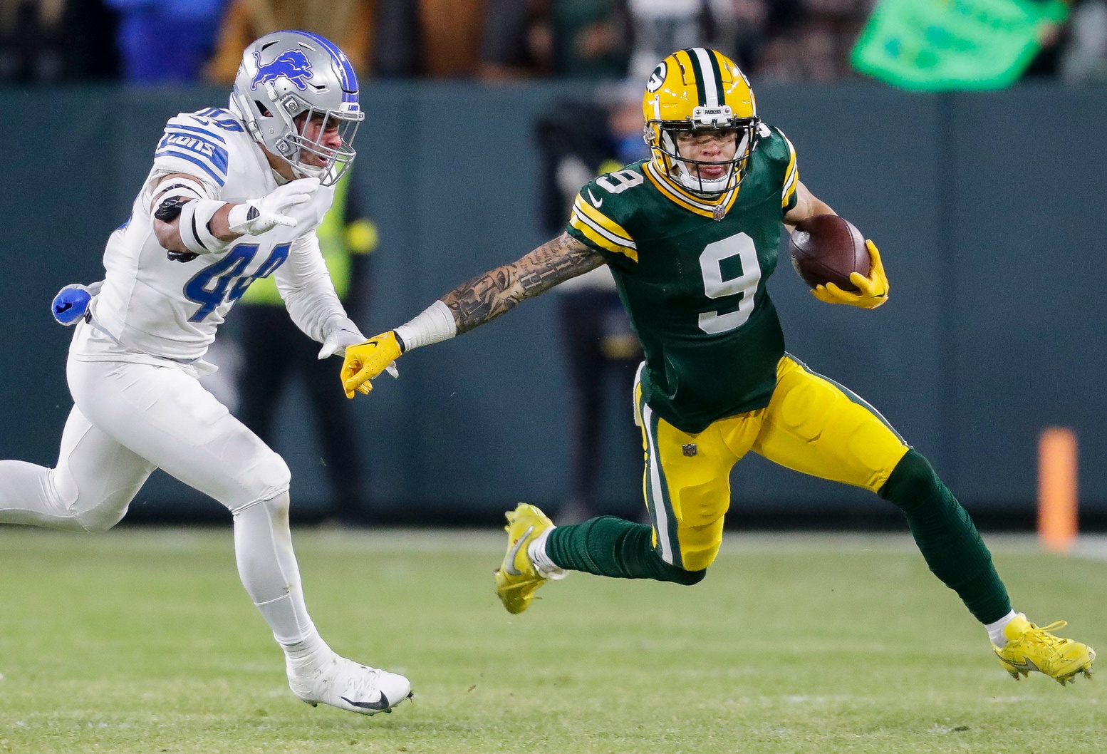 October 2, 2022: Green Bay Packers wide receiver Christian Watson (9)  scoring a touchdown during the NFL football game between the New England  Patriots and the Green Bay Packers at Lambeau Field