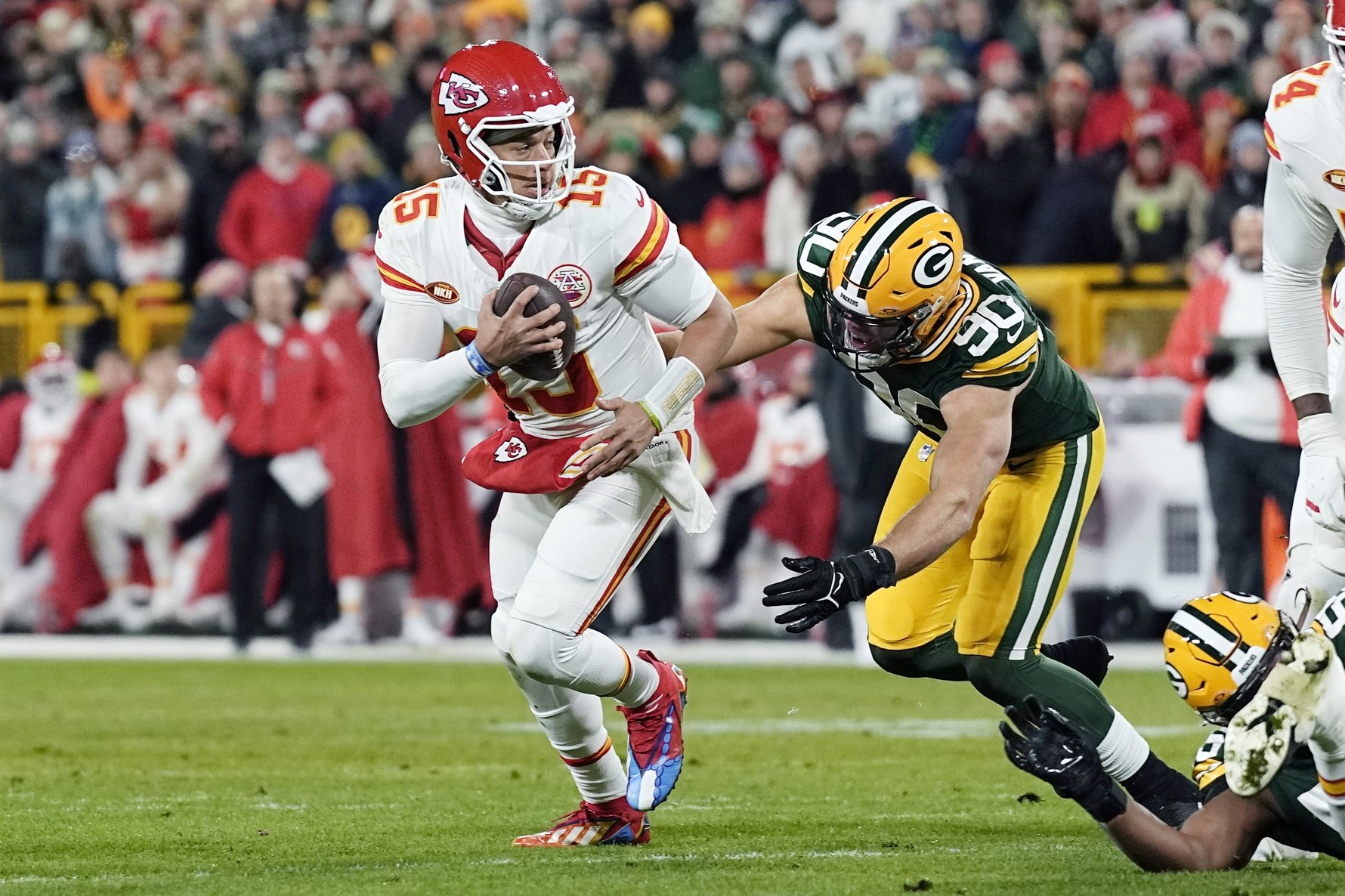 Kansas City Chiefs QB Patrick Mahomes (15) moves with the ball against the Green Bay Packers.