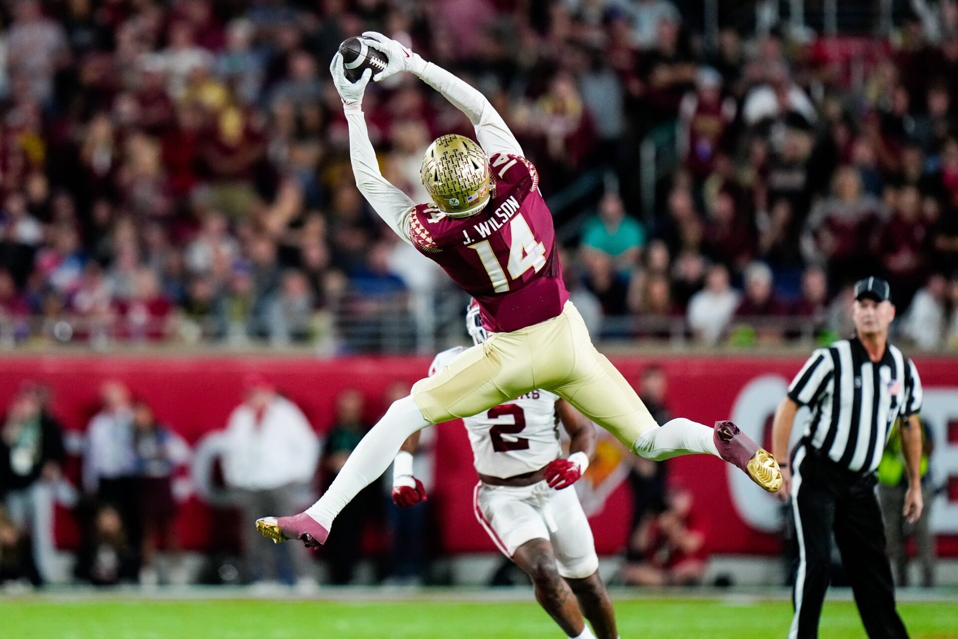 Florida State Seminoles wide receiver Johnny Wilson (14) catches a pass against the Oklahoma Sooners during the second half in the 2022 Cheez-It Bowl at Camping World Stadium.