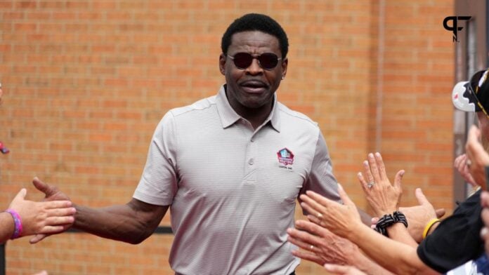 Michael Irvin arrives on the red carpet during the Pro Football Hall of Fame Class of 2022 Enshrinement at Tom Benson Hallof Fame Stadium.