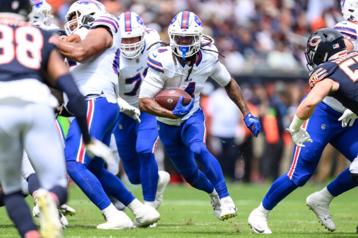 Buffalo Bills RB James Cook (4) rushes the ball against the Chicago Bears in a preseason game.
