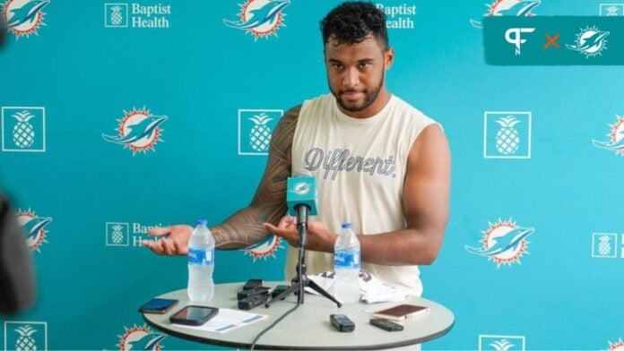 Miami Dolphins quarterback Tua Tagovailoa talks to the media during training camp.