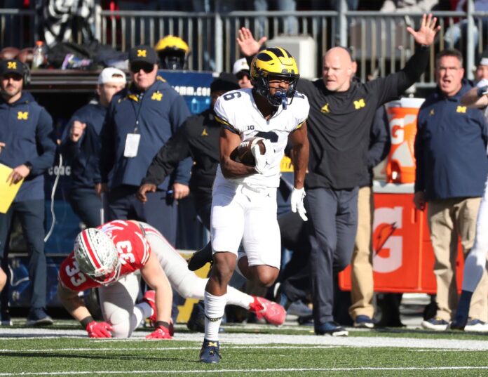 Cornelius Johnson (6) catches and runs for a touchdown against Ohio State.